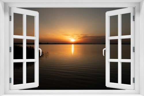 Fototapeta Naklejka Na Ścianę Okno 3D - Sunset on the lake, reflection in the water, sun path,