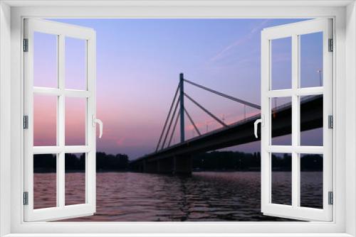 Fototapeta Naklejka Na Ścianę Okno 3D - Novi Sad, Serbia - June 15th, 2019: Bridge over Danube in Novi Sad at sunset
