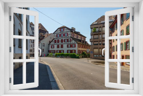 Fototapeta Naklejka Na Ścianę Okno 3D - Outdoor sunny street view of empty cityscape with typical building style, mixture between modern architecture and ancient wooden house, in Europe around Germany, Austria and Switzerland. 