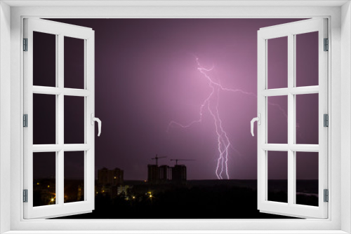 Fototapeta Naklejka Na Ścianę Okno 3D - Lightning strike over city in night. Thunderstorm
