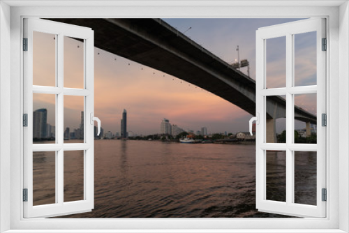 Fototapeta Naklejka Na Ścianę Okno 3D - Rama3 bridge cross over Chao phraya river in evening Bangkok, Thailand. Cityscape Concept.