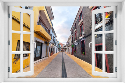 Fototapeta Naklejka Na Ścianę Okno 3D - DENIA, SPAIN - JUNE 13, 2019: Old town of Denia with narrow streets and pavement