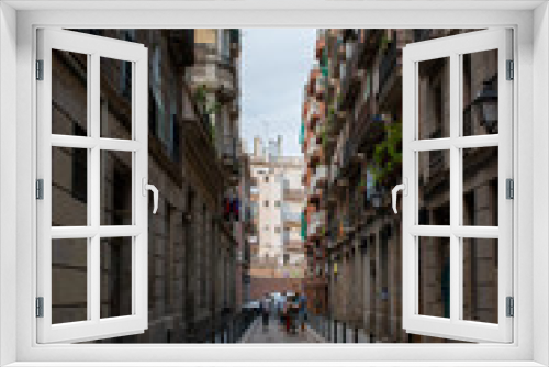 Fototapeta Naklejka Na Ścianę Okno 3D - Barcelona, Spain - 25th July 2017 - Long street with posts leading into the uknown