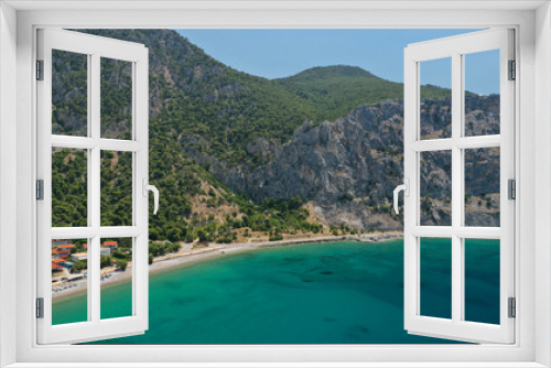 Aerial panoramic photo of famous sandy beach of Psatha in West Attica with emerald clear sea, Corinthian gulf, Greece