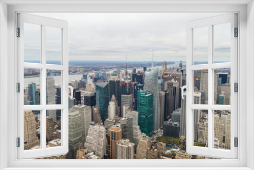Fototapeta Naklejka Na Ścianę Okno 3D - New York City skyscrapers rooftop urban view with sky and cloudy background.