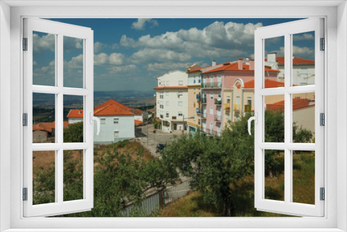 Fototapeta Naklejka Na Ścianę Okno 3D - Colorful apartment buildings on hilltop