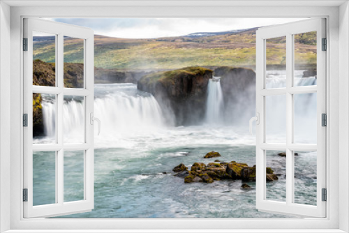 Fototapeta Naklejka Na Ścianę Okno 3D - Godafoss, Iceland waterfall view of the gods with long exposure smooth motion of water falling off cliff in summer landscape