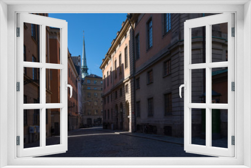 Fototapeta Naklejka Na Ścianę Okno 3D - Streets and alleys in the old town, Gamla Stan, in Stockholm an early summer morning