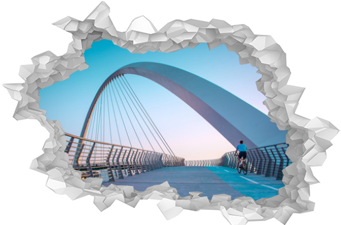 Young man riding bicycle through Dubai water canal bridge, Beautiful Architecture Design