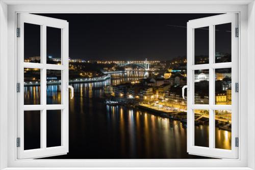 Fototapeta Naklejka Na Ścianę Okno 3D - Panoramic view of the city of Porto and Vila Nova de Gaia at night with the river Douro between the two cities, Porto, northern Portugal