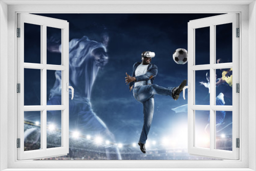 Fototapeta Naklejka Na Ścianę Okno 3D - Virtual Reality headset on a black male playing soccer