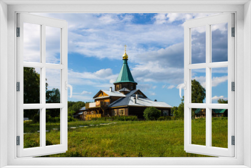 Fototapeta Naklejka Na Ścianę Okno 3D - Orthodox wooden Church on a clear Sunny day Russia against the blue sky