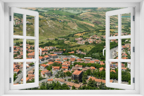 Fototapeta Naklejka Na Ścianę Okno 3D - Panoramic View of San Marino with a Road Crossing the Beautiful Landscape