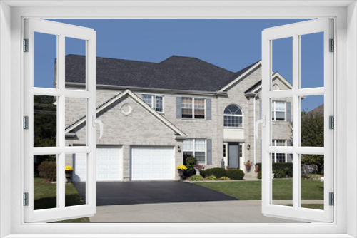 Fototapeta Naklejka Na Ścianę Okno 3D - Light brick home with double arched garage