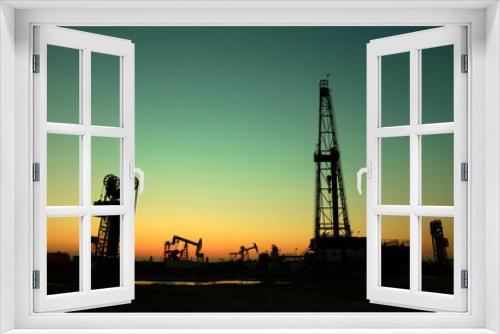 Fototapeta Naklejka Na Ścianę Okno 3D - Oil drilling derrick in oilfield