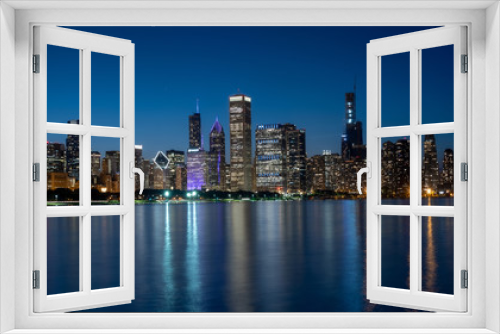 Fototapeta Naklejka Na Ścianę Okno 3D - The citylights of Chicago Skyline in the evening - CHICAGO, ILLINOIS - JUNE 12, 2019