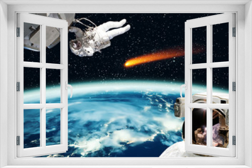 Fototapeta Naklejka Na Ścianę Okno 3D - Astronaut and comet. The elements of this image furnished by NASA.