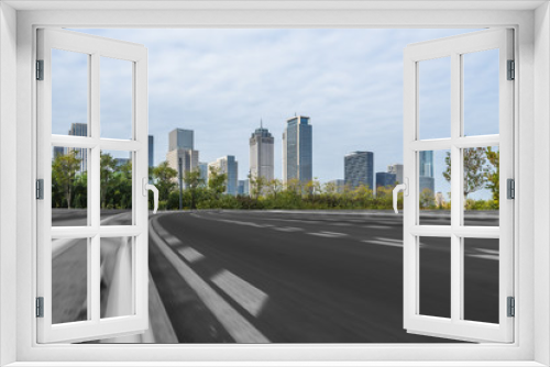 Fototapeta Naklejka Na Ścianę Okno 3D - empty asphalt road on modern bridge with city skyline background.