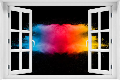 Fototapeta Naklejka Na Ścianę Okno 3D - Explosion of multicolored dust on black background.