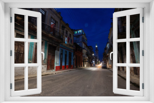 Fototapeta Naklejka Na Ścianę Okno 3D - Street view of the residential neighborhood in the Old Havana City, Capital of Cuba, during night time after sunset.