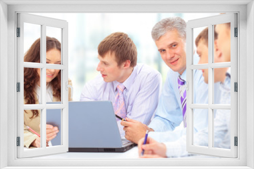 Group of happy business people in a meeting at office