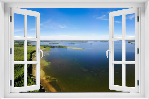 Fototapeta Naklejka Na Ścianę Okno 3D - Nature in the summer. Forests, fields, meadows, lake, river and village. View from the sky. The photo was taken by a copter. Panorama. The concept is a favorable environment. Blue sky. Background.