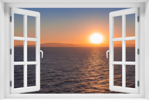 Fototapeta Naklejka Na Ścianę Okno 3D - Beautiful sunset over the sea with islands of Saronic Gulf background