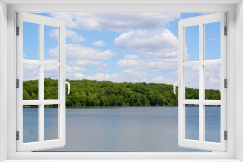 Fototapeta Naklejka Na Ścianę Okno 3D - A beautiful view of the peaceful lake on a sunny day.