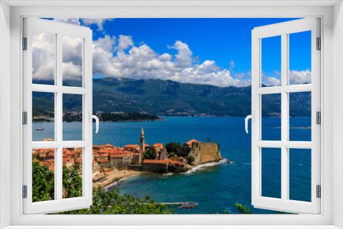 Fototapeta Naklejka Na Ścianę Okno 3D - Panoramic view of Budva Old Town with an ancient Citadel and Adriatic Sea with mountains in the background in Montenegro