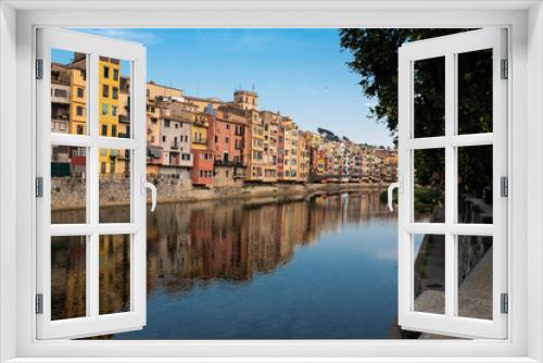 Fototapeta Naklejka Na Ścianę Okno 3D - Girona main landmark river houses reflection on a blue sunny day