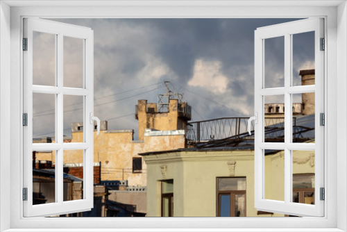 Fototapeta Naklejka Na Ścianę Okno 3D - roofs of town houses
