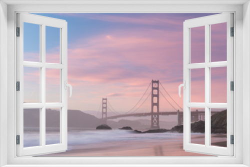 Fototapeta Naklejka Na Ścianę Okno 3D - Classic panoramic view of famous Golden Gate Bridge seen from scenic Baker Beach in beautiful golden evening light on sunset with blue sky and clouds in summer, San Francisco, California, USA