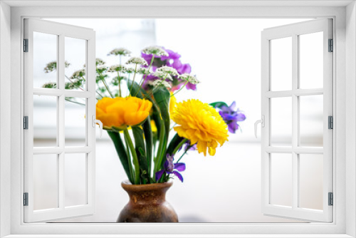 Fototapeta Naklejka Na Ścianę Okno 3D - Closeup of plant bouquet vase with yellow plants on table in room by window with yellow and purple flowers