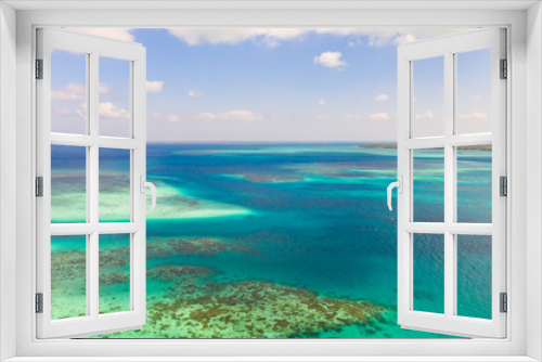 Fototapeta Naklejka Na Ścianę Okno 3D - Coral reefs and atolls in the tropical sea, top view. Turquoise sea water and beautiful shallows. Philippine nature.