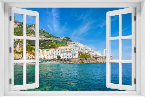 Fototapeta Naklejka Na Ścianę Okno 3D - Beautiful Amalfi on hills leading down to coast, comfortable beaches and azure sea on Amalfi Coast in Campania, Italy