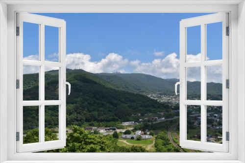 Fototapeta Naklejka Na Ścianę Okno 3D - Landscape with mountain and town in Hokkaido, Japan