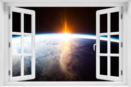 Fototapeta Naklejka Na Ścianę Okno 3D - Earth planet and sunrise view from space - element of this image provided by Nasa