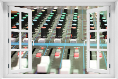 recording studio professional audio mixer close-up, blurred
