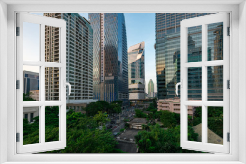 Tranquility inside the city. Image of green zone and modern buildings (Bangkok, Thailand)