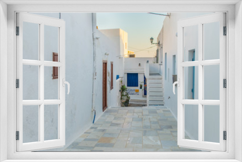 Fototapeta Naklejka Na Ścianę Okno 3D - Street view of Plaka village with paved alleys and traditional cycladic architecture in Milos island in Cyclades, Greece