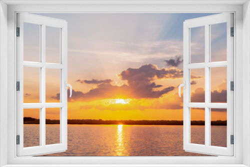 Fototapeta Naklejka Na Ścianę Okno 3D - Sunset reflection lagoon. beautiful sunset behind the clouds and blue sky above the over lagoon landscape background. dramatic sky with cloud at sunset