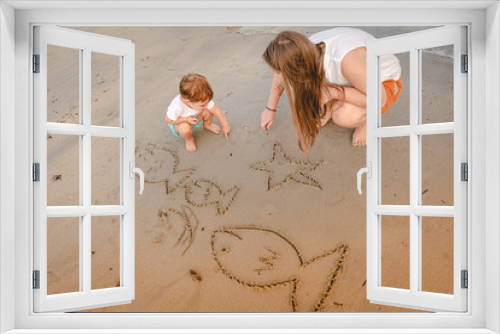Fototapeta Naklejka Na Ścianę Okno 3D - Madre e figlia giocano al mare