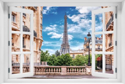 Fototapeta Naklejka Na Ścianę Okno 3D - Small Paris street with view on the famous Eiffel Tower in Paris, France.