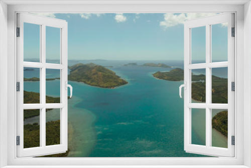 Fototapeta Naklejka Na Ścianę Okno 3D - Aerial drone small island group in province of Palawan. Busuanga, Philippines. Seascape, islands covered with forest, sea with blue water. tropical landscape, travel concept