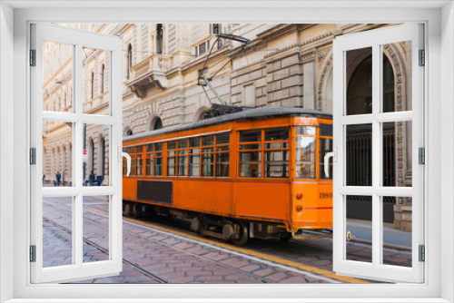 Fototapeta Naklejka Na Ścianę Okno 3D - Old vintage tram in the city centre of the Milan, Lombardia, Italy. Famous tourist destination in South Europe