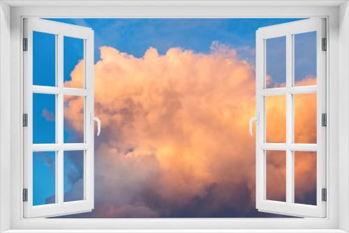 big fluffy yellow cloud in bright blue sky