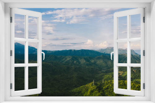 Fototapeta Naklejka Na Ścianę Okno 3D - Aerial view of mountains and chewed roads on the mountain during sunset at Khao Kho Viewpoint, Phetchabun Province, Thailand