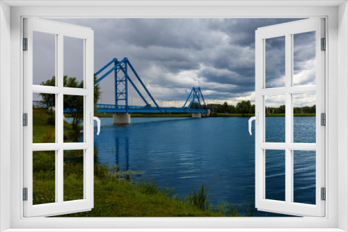 Fototapeta Naklejka Na Ścianę Okno 3D - Picturesque pedestrian bridge across the river