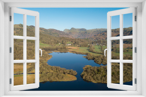 Fototapeta Naklejka Na Ścianę Okno 3D - Aerial view and vista of the Langdale Pikes from above Elterwater in the glorious English Lake District