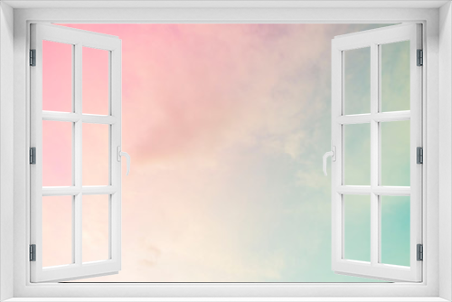 A soft cloud background with a pastel colored orange to blue gradient.